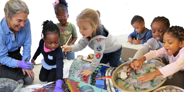 Artist Sue Stockman and Head Start students work on the mosaic mural (HCAC photos)