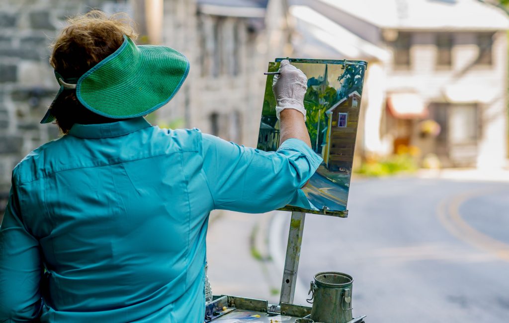 An artist at work during Paint It! Ellicott City (photo by Ray Urena)