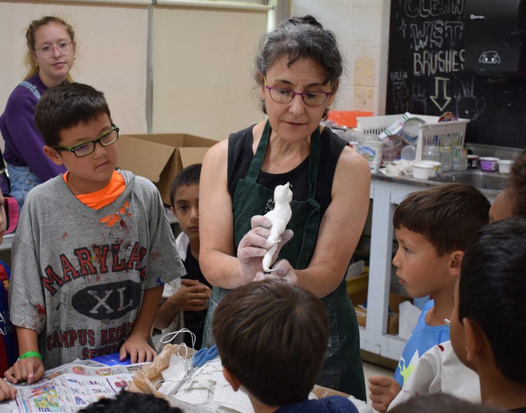 Instructor Suzanne Herbert-Forton demonstrates a technique for summer campers (HCAC photo)