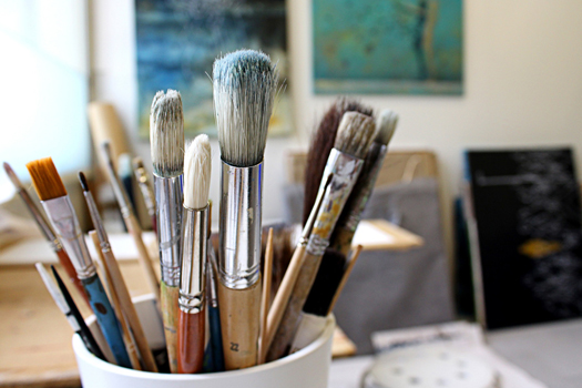 Stock photo of brushes & art studio courtesy of Pixabay