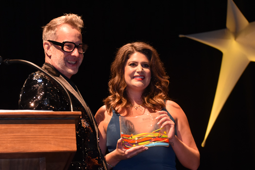 MaryKate Brouillet, pictured with Celebration emcee Joseph W. Ritsch, accepts the 2021 Rising Star award (HCAC photo)