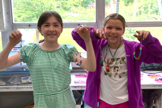 Summer campers display their finished beadwork (HCAC photo)