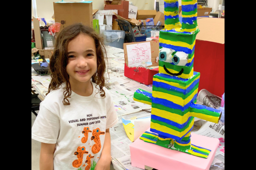PHOTO CAPTION: A 2023 summer camper with her upcycled project (HCAC photo).