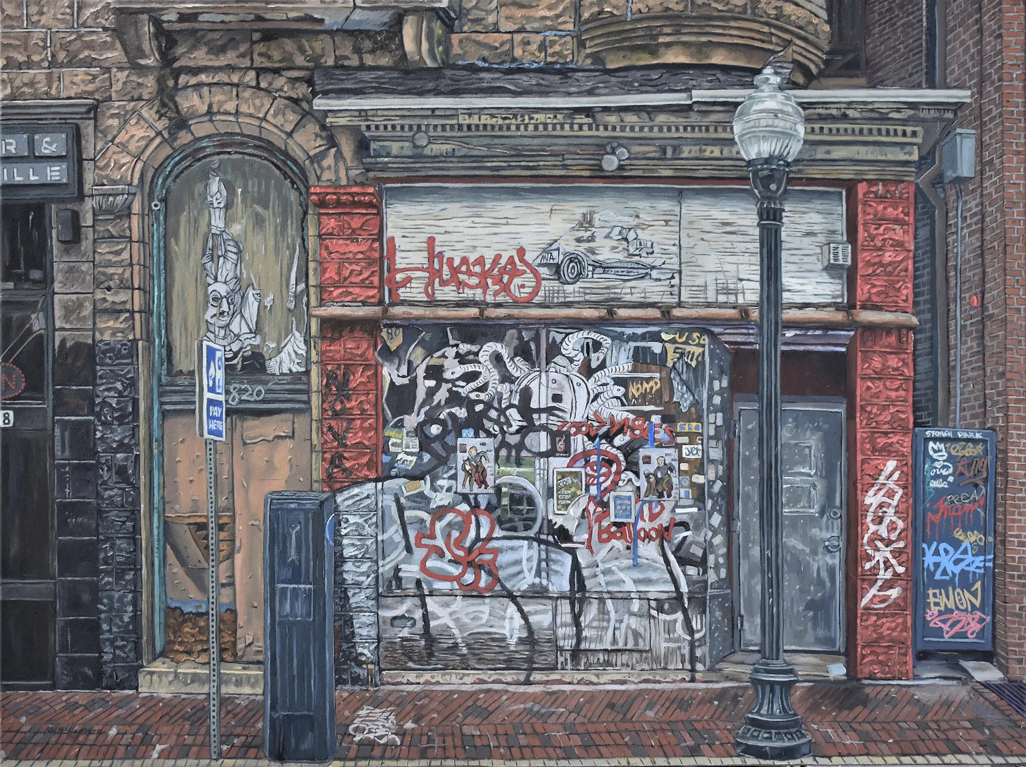 Front view of an old city building tagged with layers of graffiti sits adjacent to a parking meter and street light.