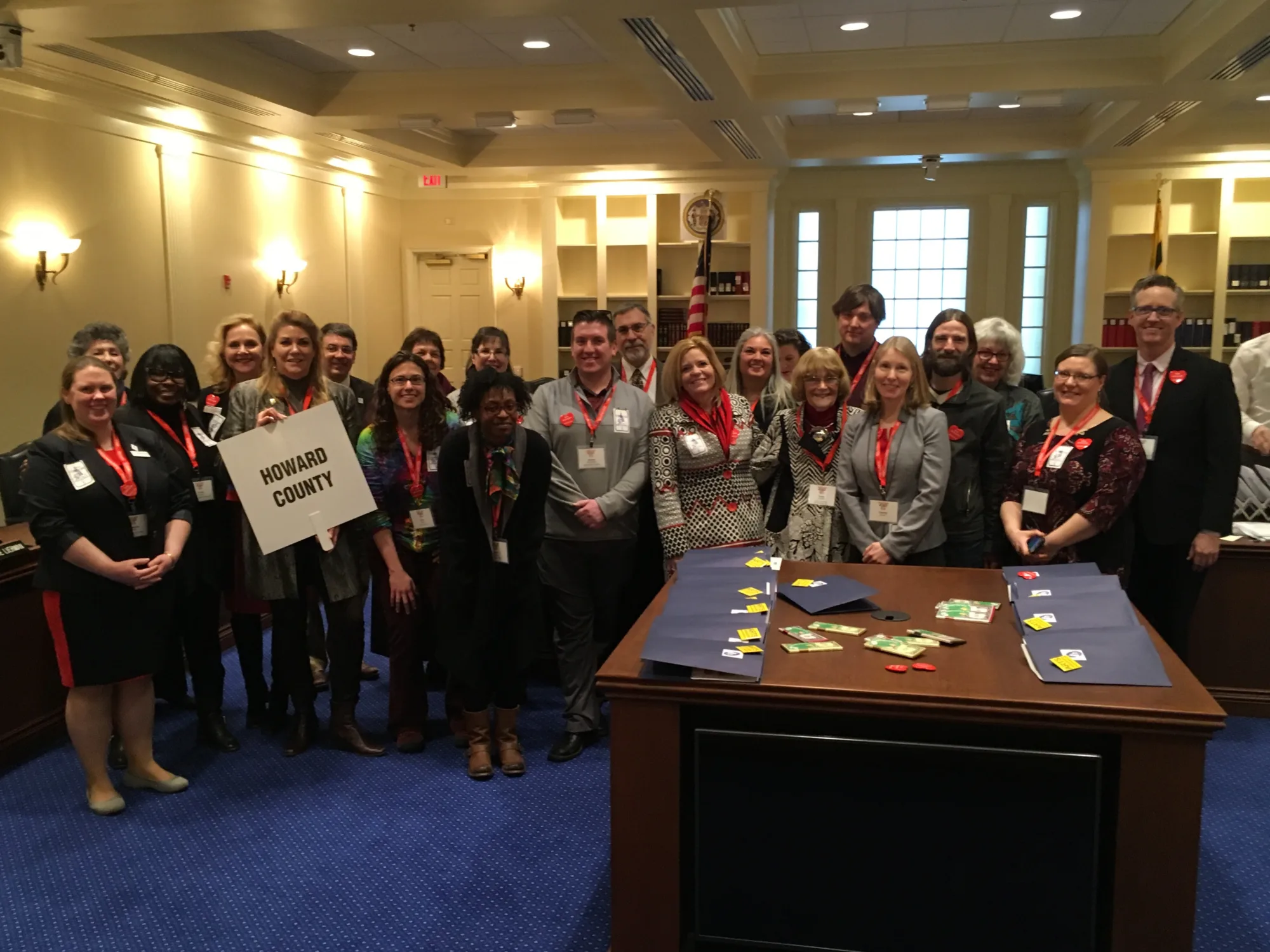 Group of people at Maryland State Capital with woman holding Howard County sign.