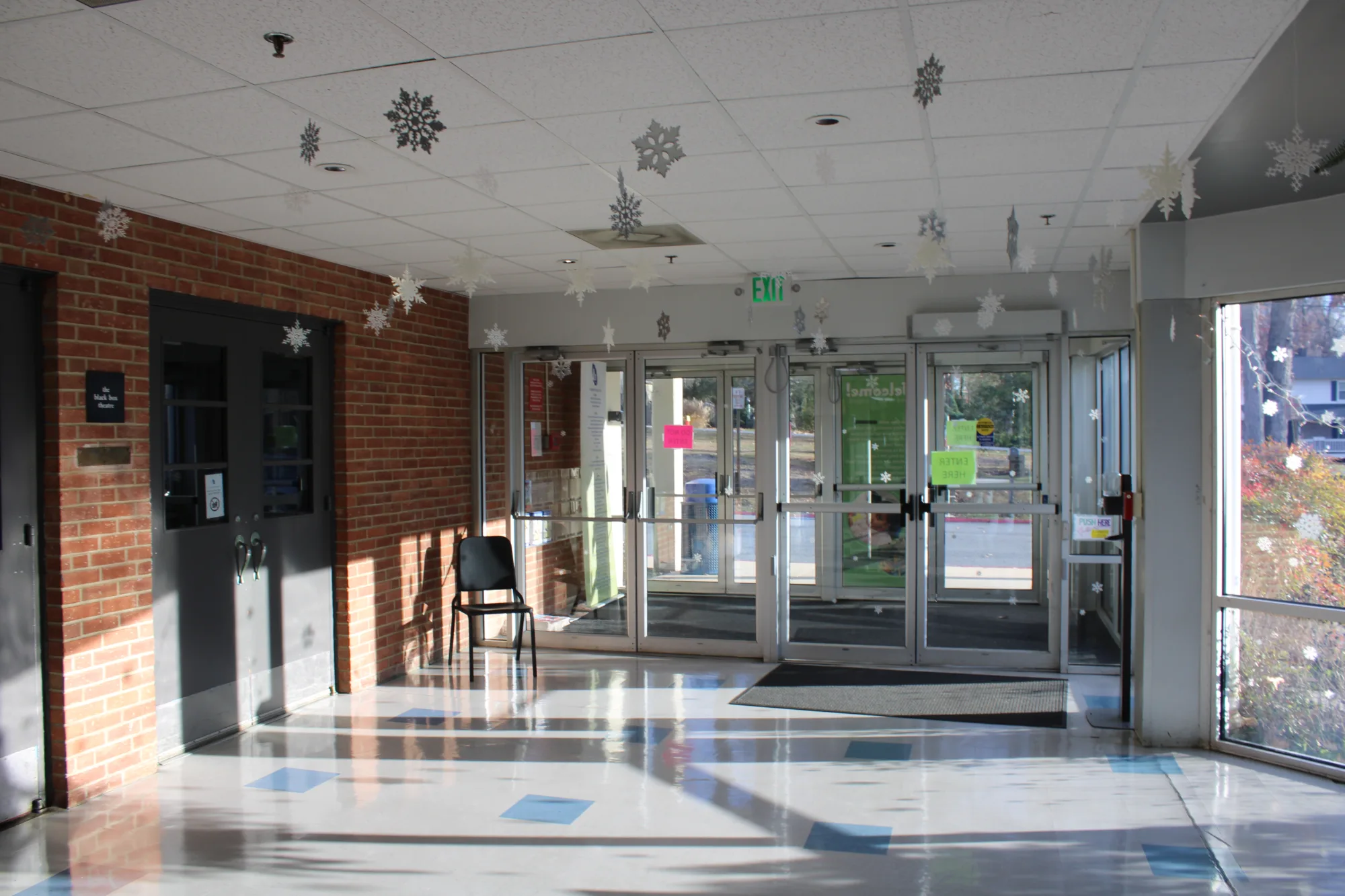 Building lobby with snowflakes hanging from the ceiling