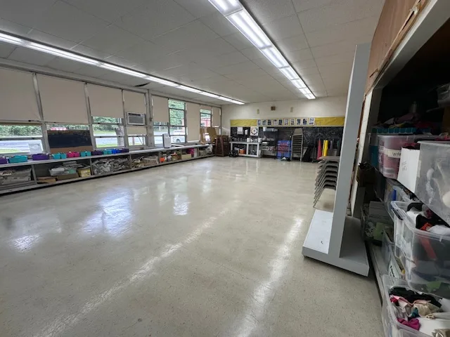 Empty arts classroom with windows on the left
