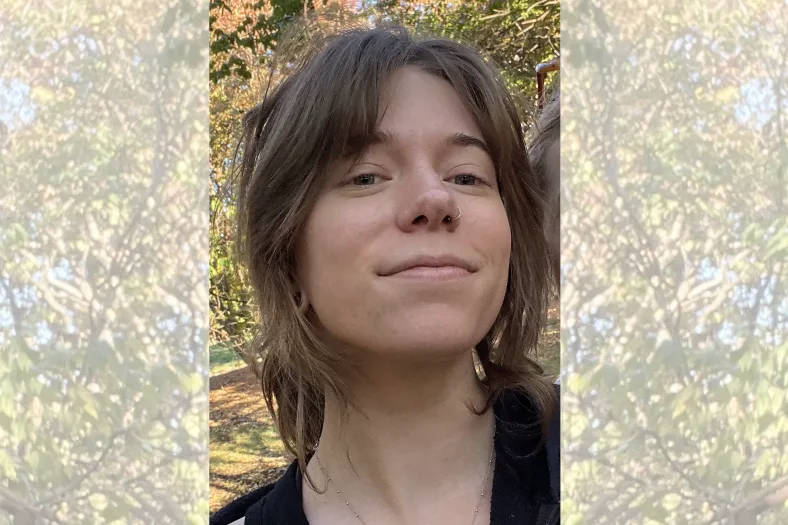 person in front of trees in a park
